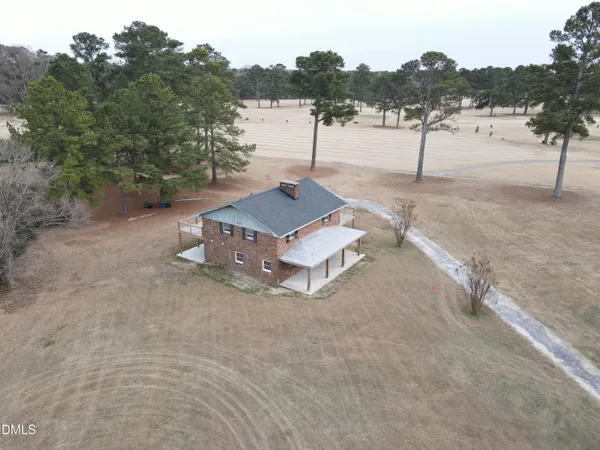 a house with trees in the background