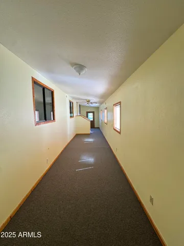 a view of empty room with windows