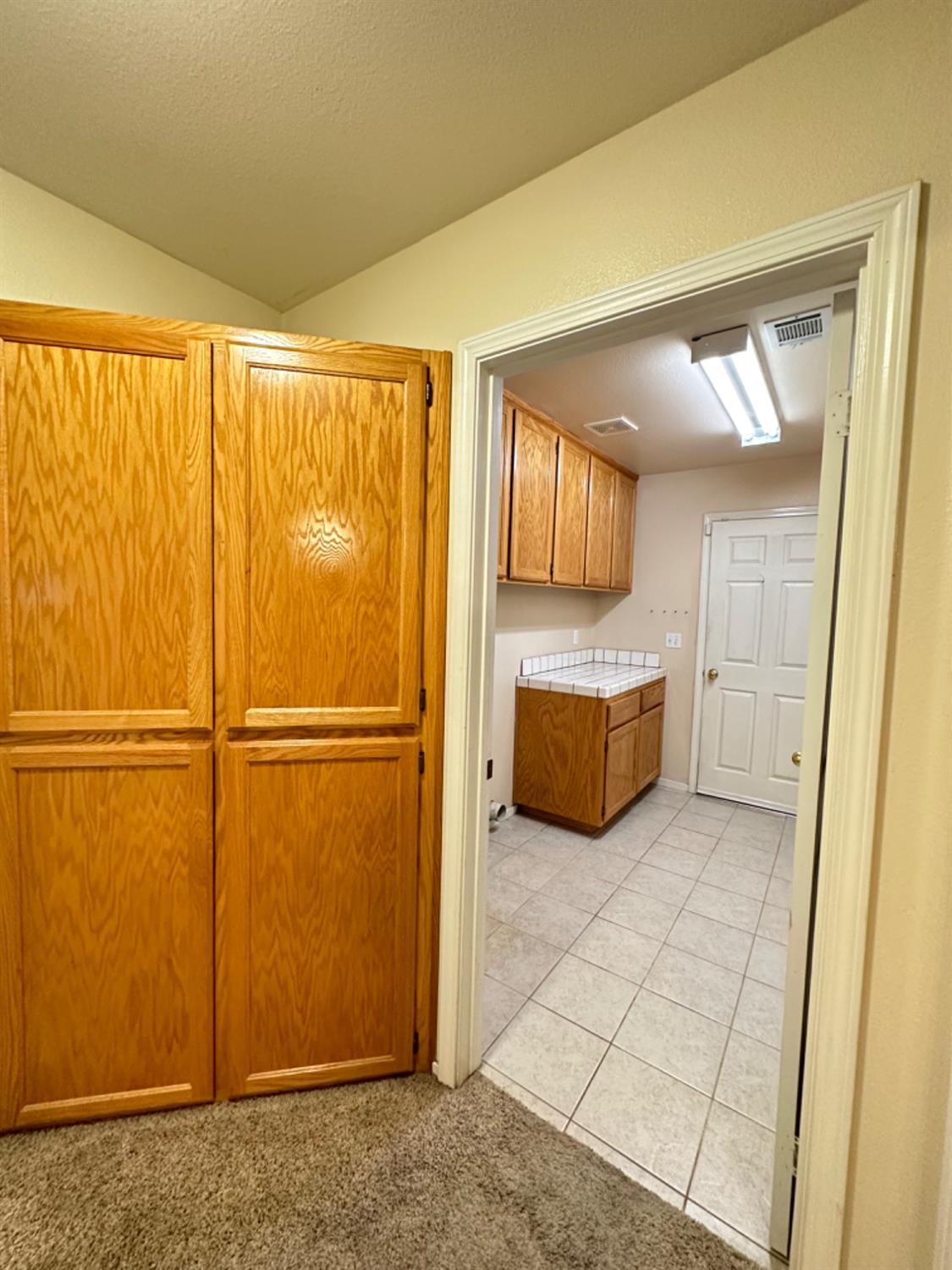 596 Grenache Avenue Madera, CA 93637 - Photo 19 of 26 a view of a room with a fridge