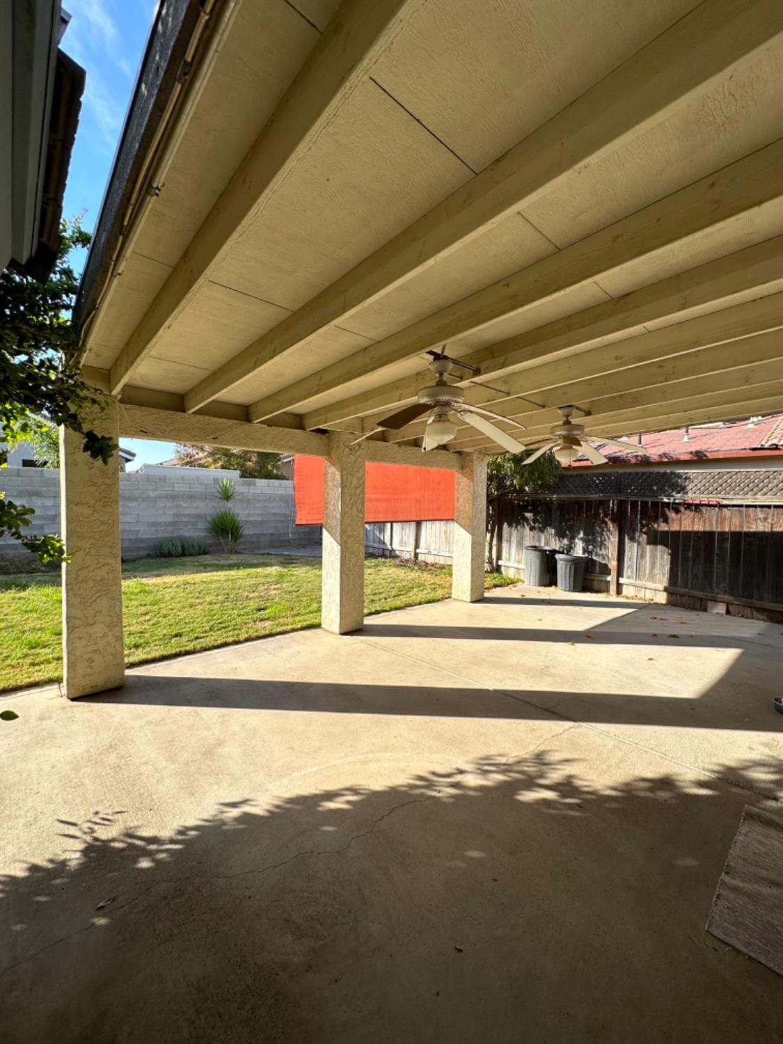 596 Grenache Avenue Madera, CA 93637 - Photo 20 of 26 a view of a car park in front of a building