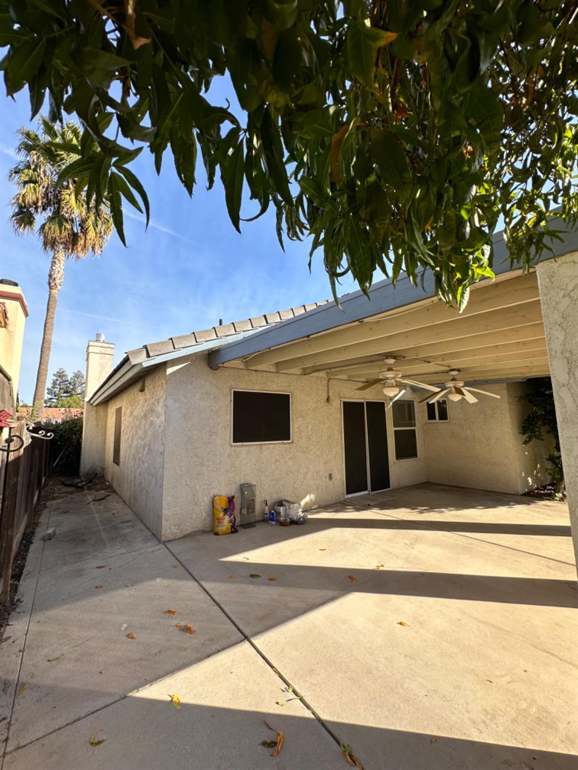 596 Grenache Avenue Madera, CA 93637 - Photo 23 of 26 a view of a house with a tree