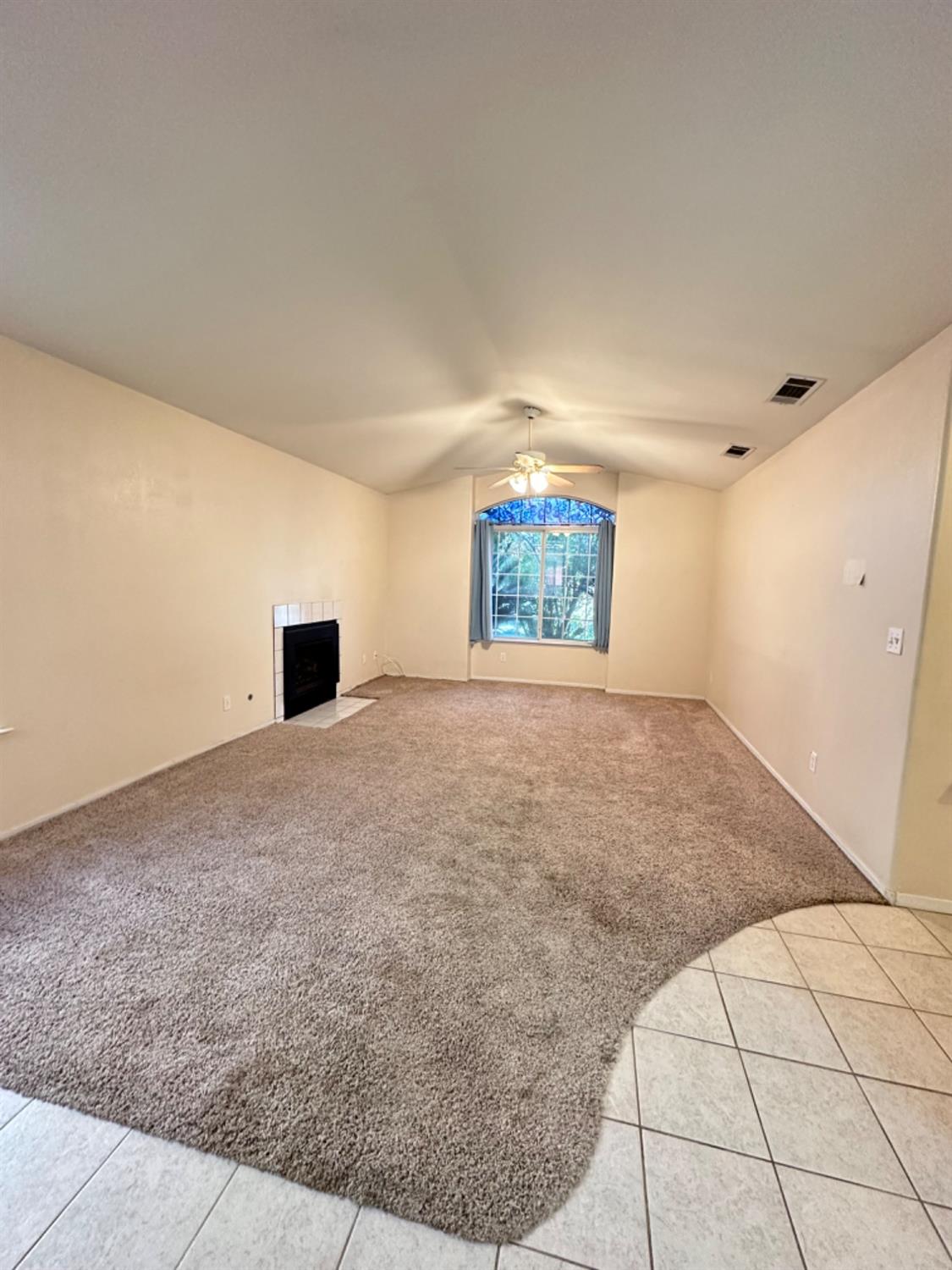 596 Grenache Avenue Madera, CA 93637 - Photo 5 of 26 a view of an empty room with a window