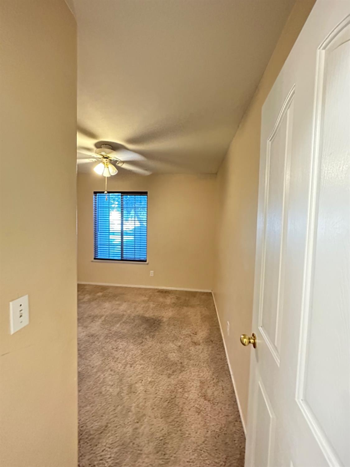 596 Grenache Avenue Madera, CA 93637 - Photo 10 of 26 an empty room with windows