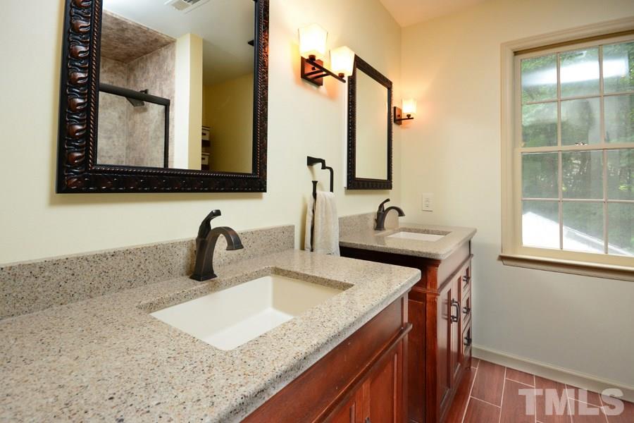 6013 Hampton Ridge Road Raleigh, NC 27603 - Photo 13 of 25 a bathroom with sink and mirror