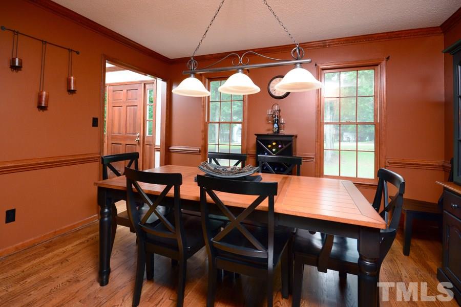 6013 Hampton Ridge Road Raleigh, NC 27603 - Photo 5 of 25 a view of a dining room with furniture and window