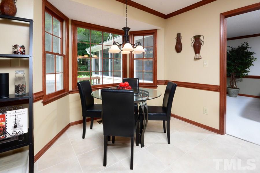 6013 Hampton Ridge Road Raleigh, NC 27603 - Photo 6 of 25 a dining room with furniture and window
