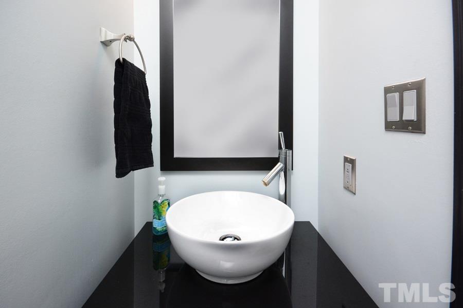 6013 Hampton Ridge Road Raleigh, NC 27603 - Photo 10 of 25 a bathroom with a sink and a mirror