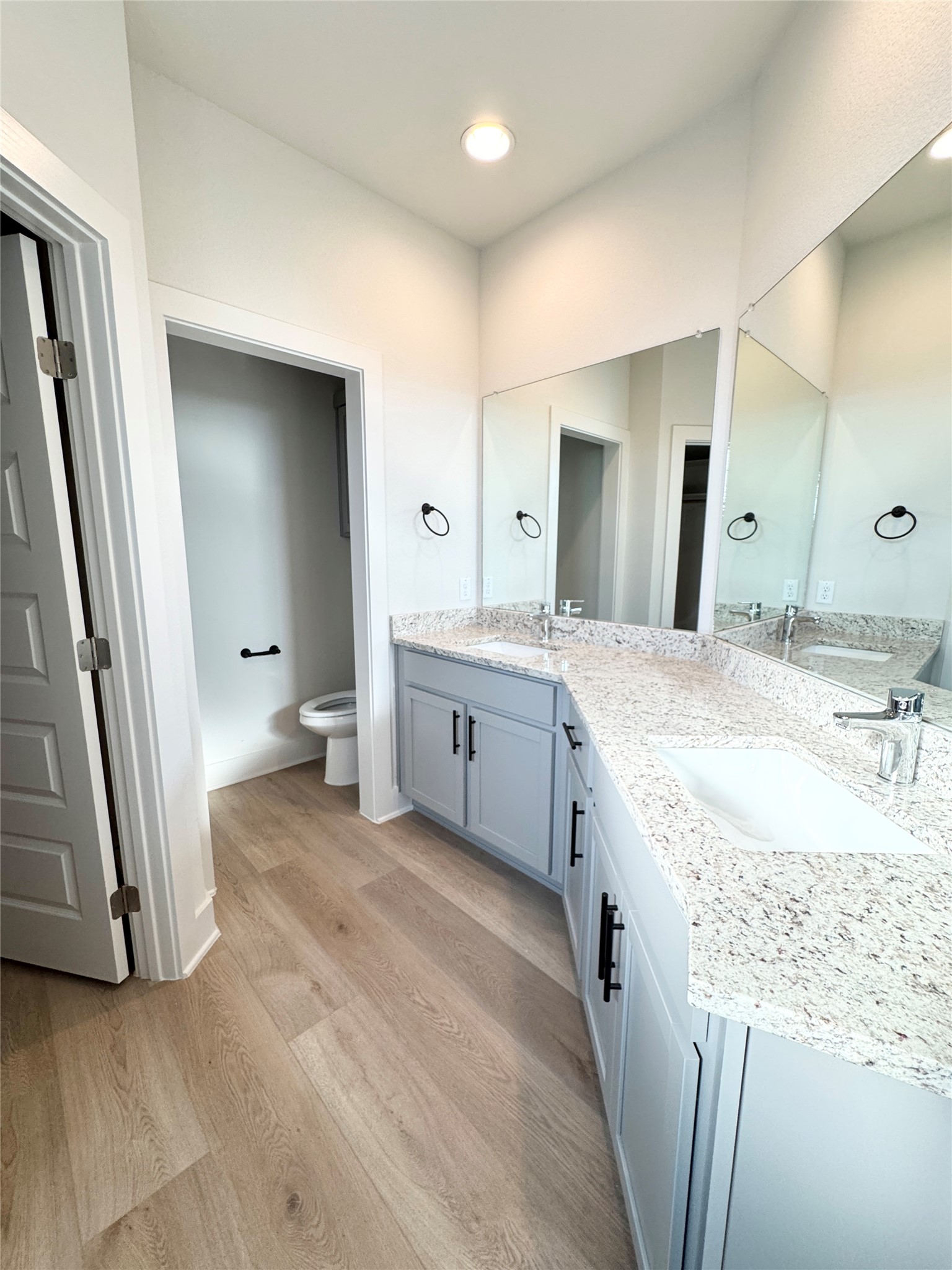 100 Zayd Court, Unit A Jarrell, TX 76537 - Photo 4 of 20 a spacious bathroom with a granite countertop sink and a mirror