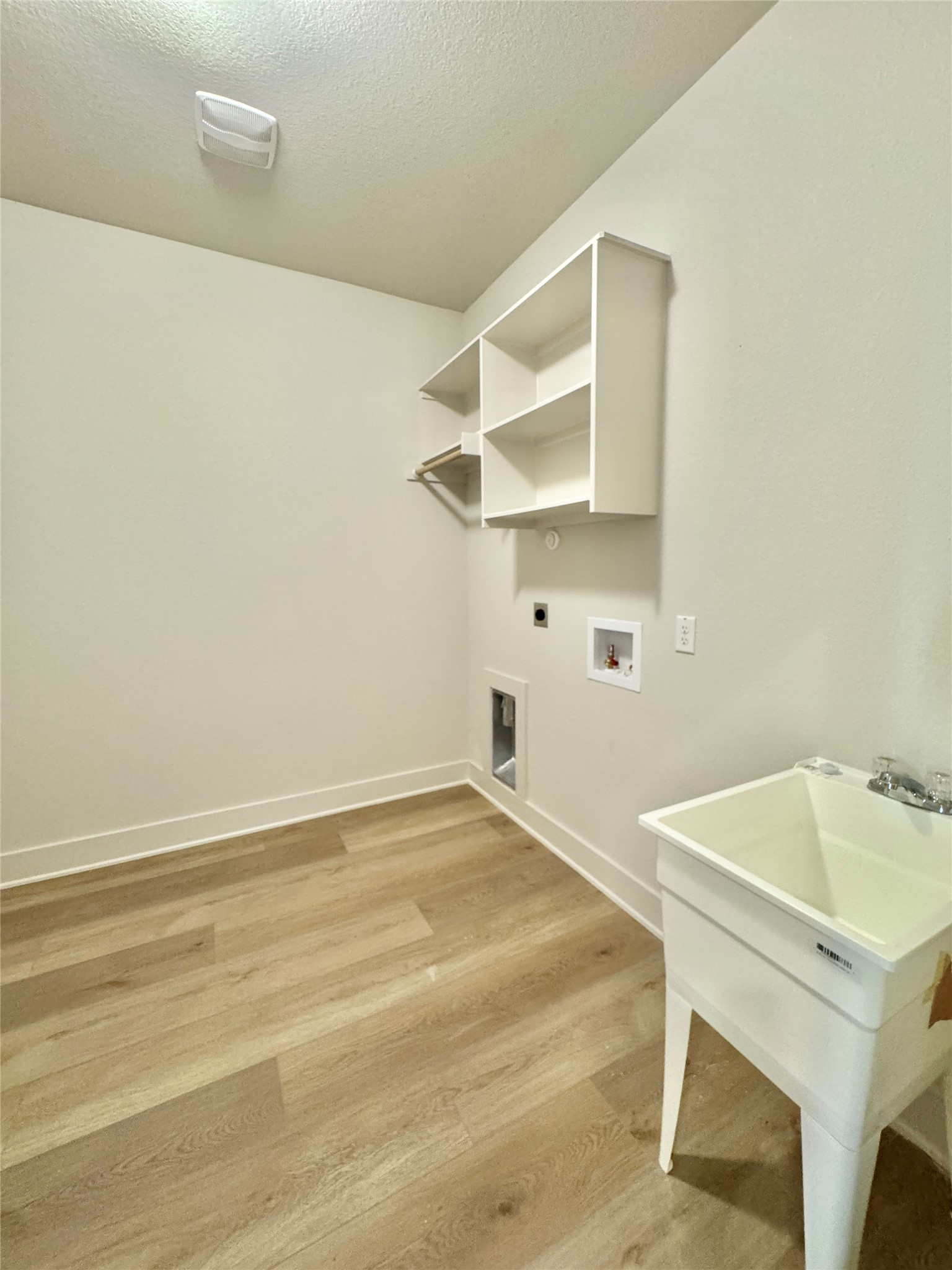 100 Zayd Court, Unit A Jarrell, TX 76537 - Photo 6 of 20 a view of a room with racks on the wall