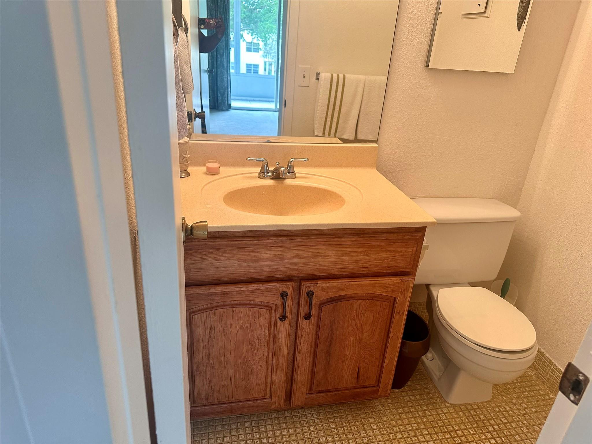 200 Mansfield F, Unit 200 Boca Raton, FL 33434 - Photo 15 of 15 a bathroom with a toilet and a sink