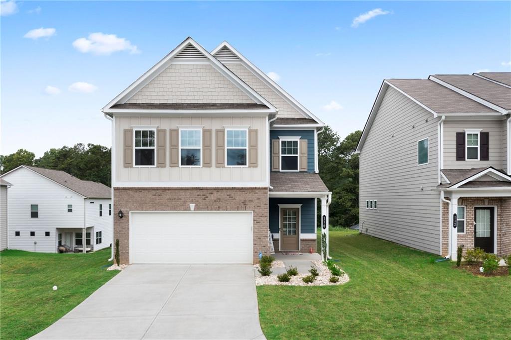 110 Waterside Ridgg Calhoun, GA 30701 - Photo 1 of 31 a front view of a house with a yard and garage