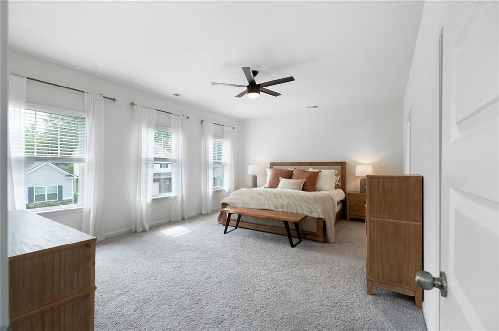 110 Waterside Ridgg Calhoun, GA 30701 - Photo 18 of 31 a spacious bedroom with a bed and large windows