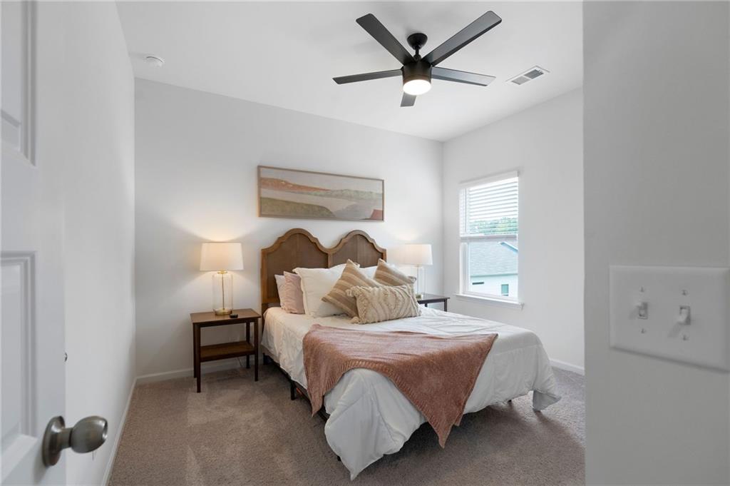 110 Waterside Ridgg Calhoun, GA 30701 - Photo 22 of 31 a bedroom with a bed and a painting on the wall