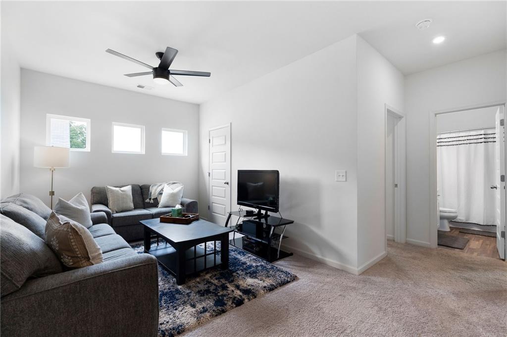 110 Waterside Ridgg Calhoun, GA 30701 - Photo 25 of 31 a living room with furniture and a flat screen tv