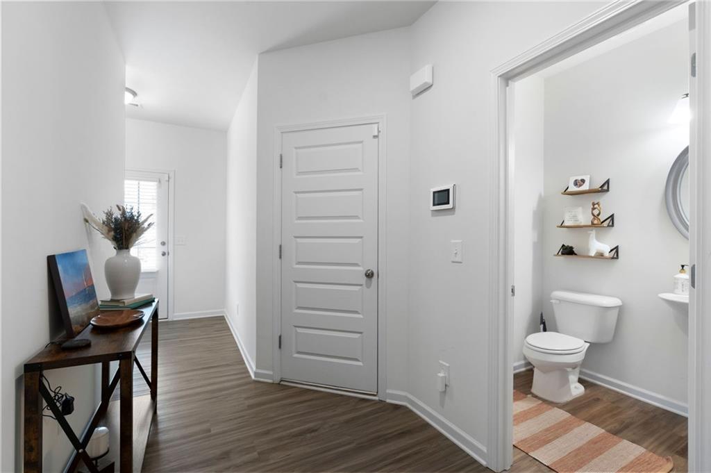 110 Waterside Ridgg Calhoun, GA 30701 - Photo 6 of 31 a view of a room with wooden floor and chair