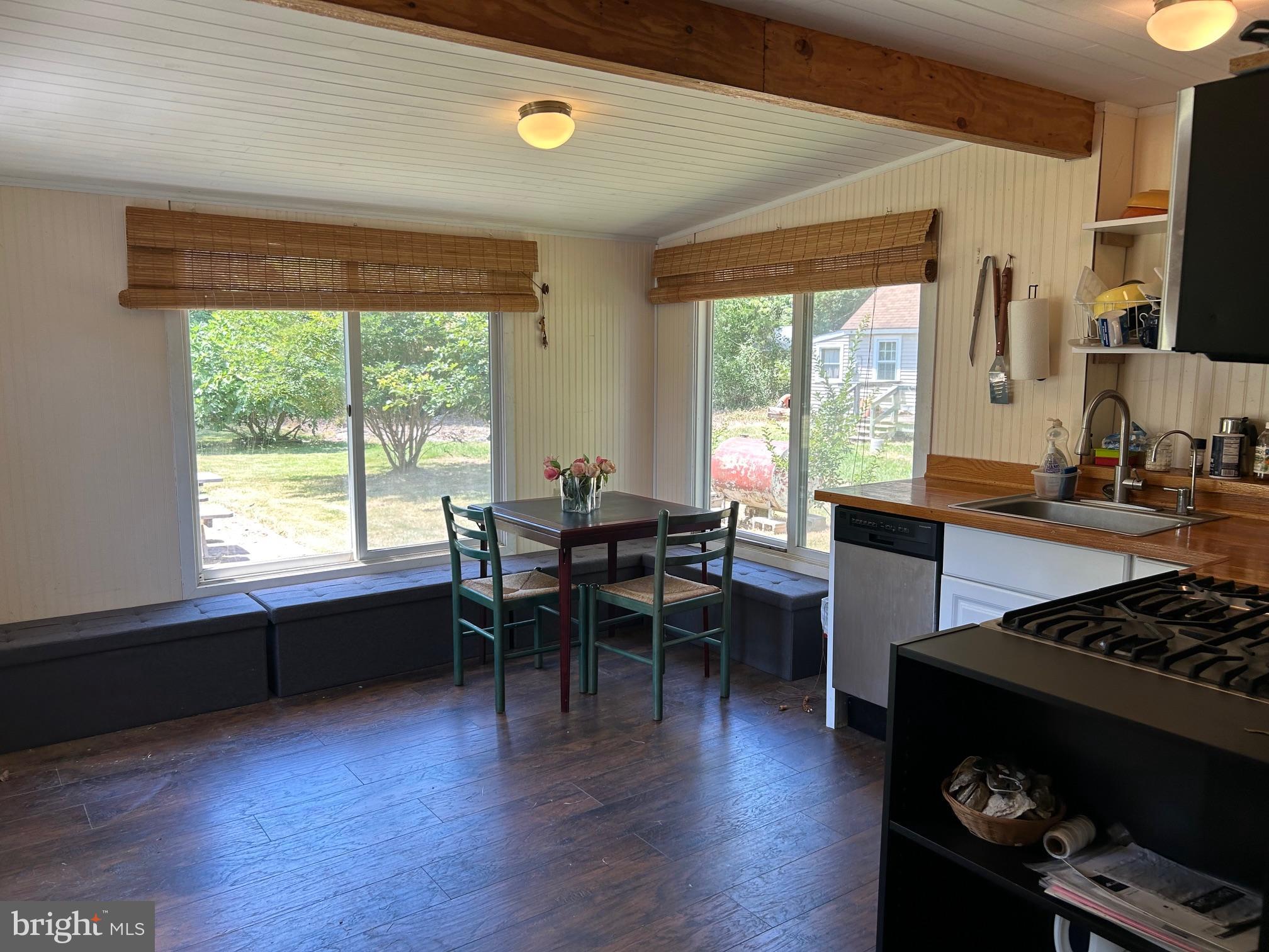 8808 Cummings Road Wittman, MD 21676 - Photo 11 of 21 eat-in kitchen with wrap-around sliding windows