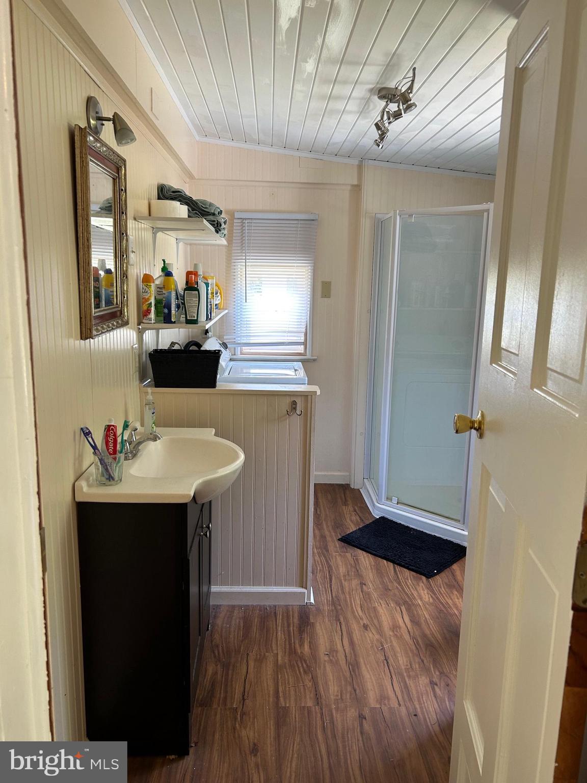 8808 Cummings Road Wittman, MD 21676 - Photo 13 of 21 main floor bath and laundry