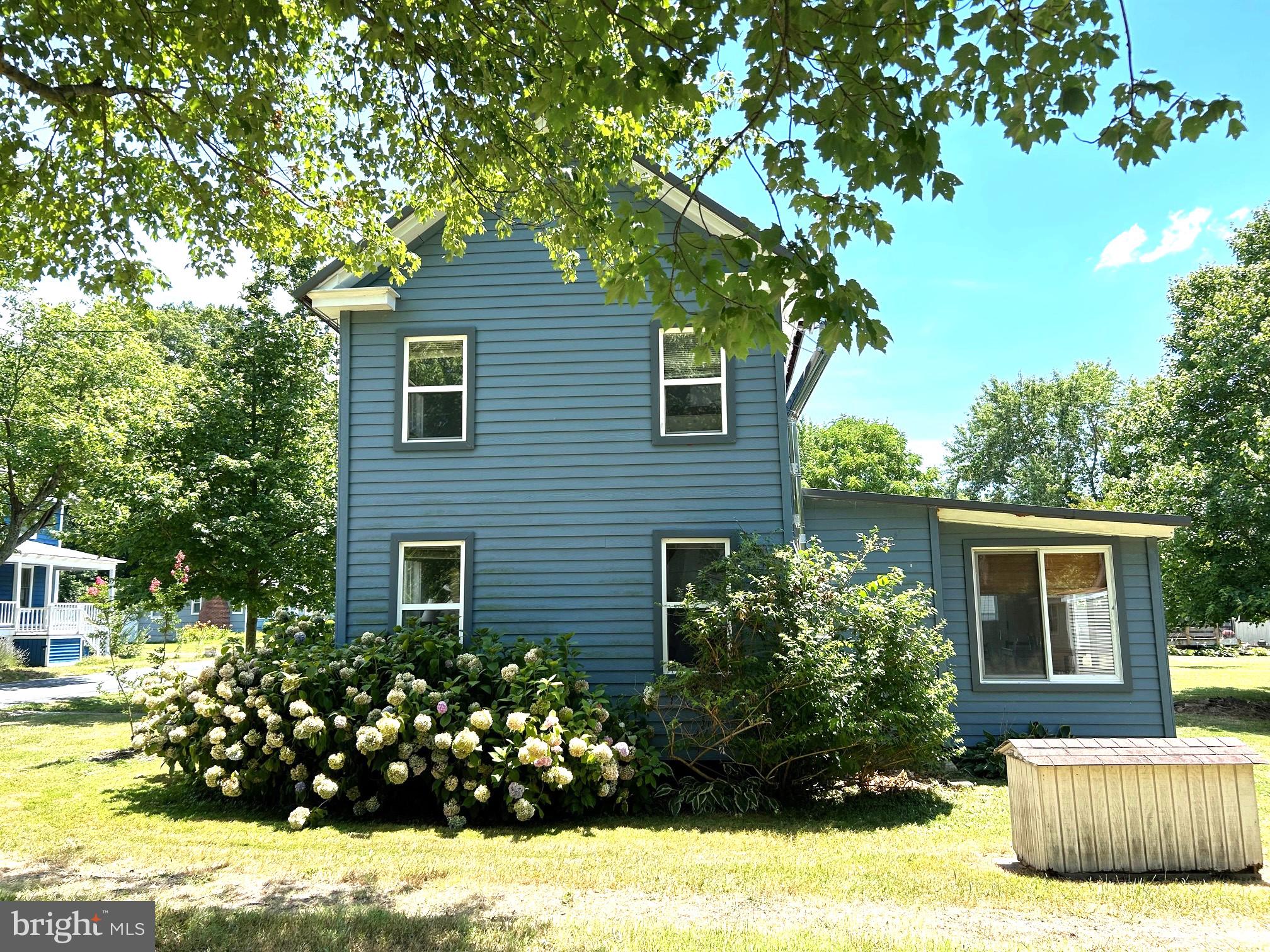8808 Cummings Road Wittman, MD 21676 - Photo 5 of 21 north side of house with hydrangeas
