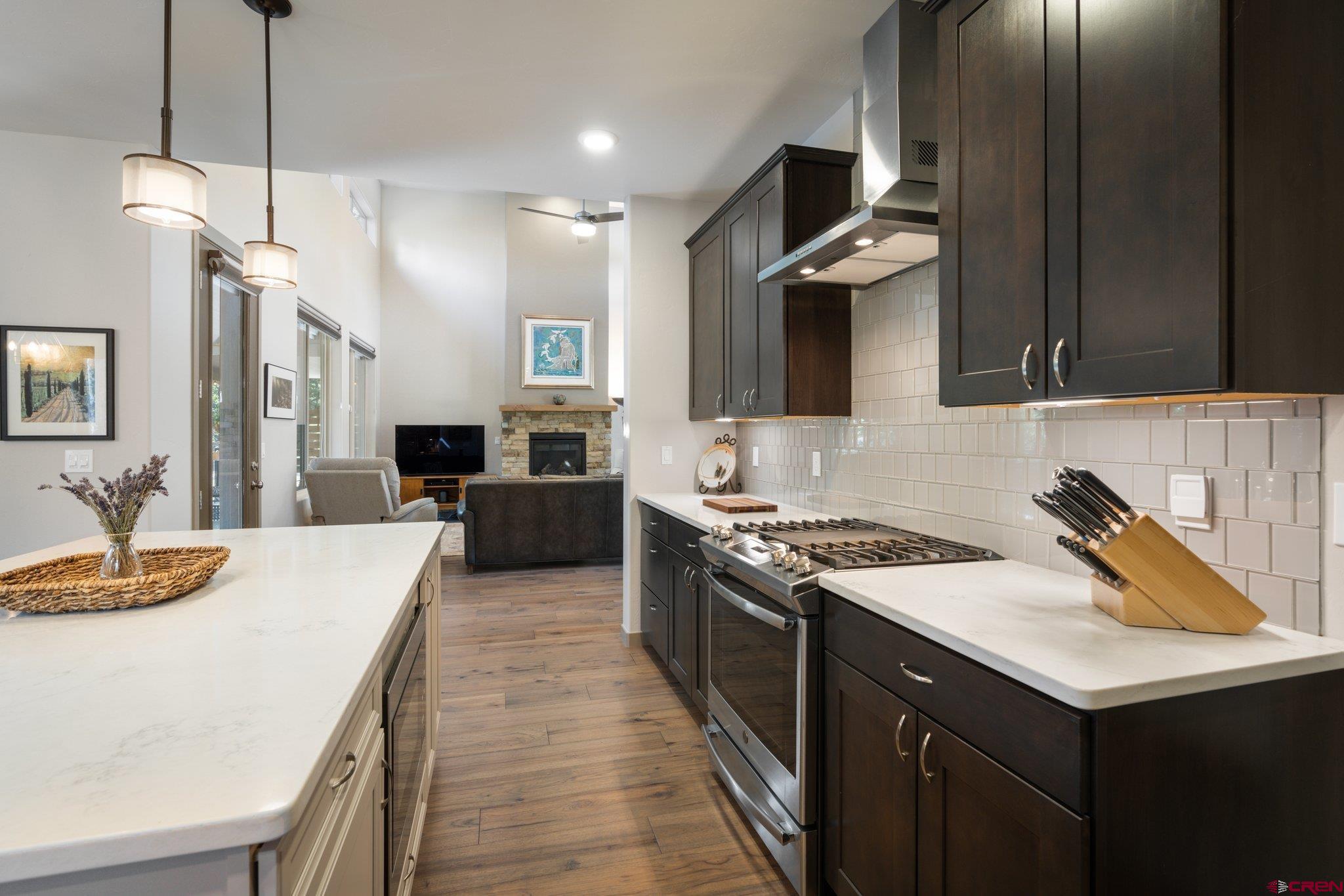65 Needle Creek Trail Durango, CO 81301 - Photo 12 of 35 a kitchen with a sink stove and refrigerator