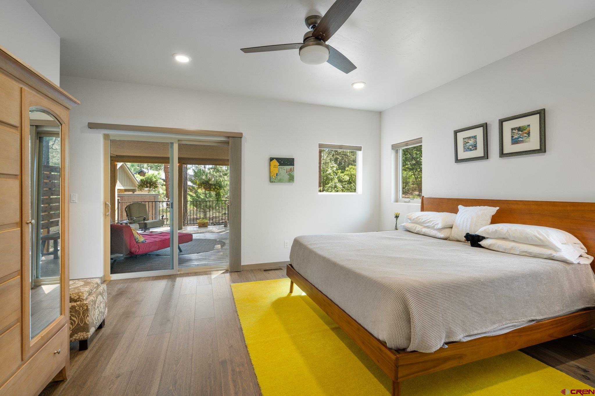 65 Needle Creek Trail Durango, CO 81301 - Photo 17 of 35 a bedroom with a bed and wooden floor