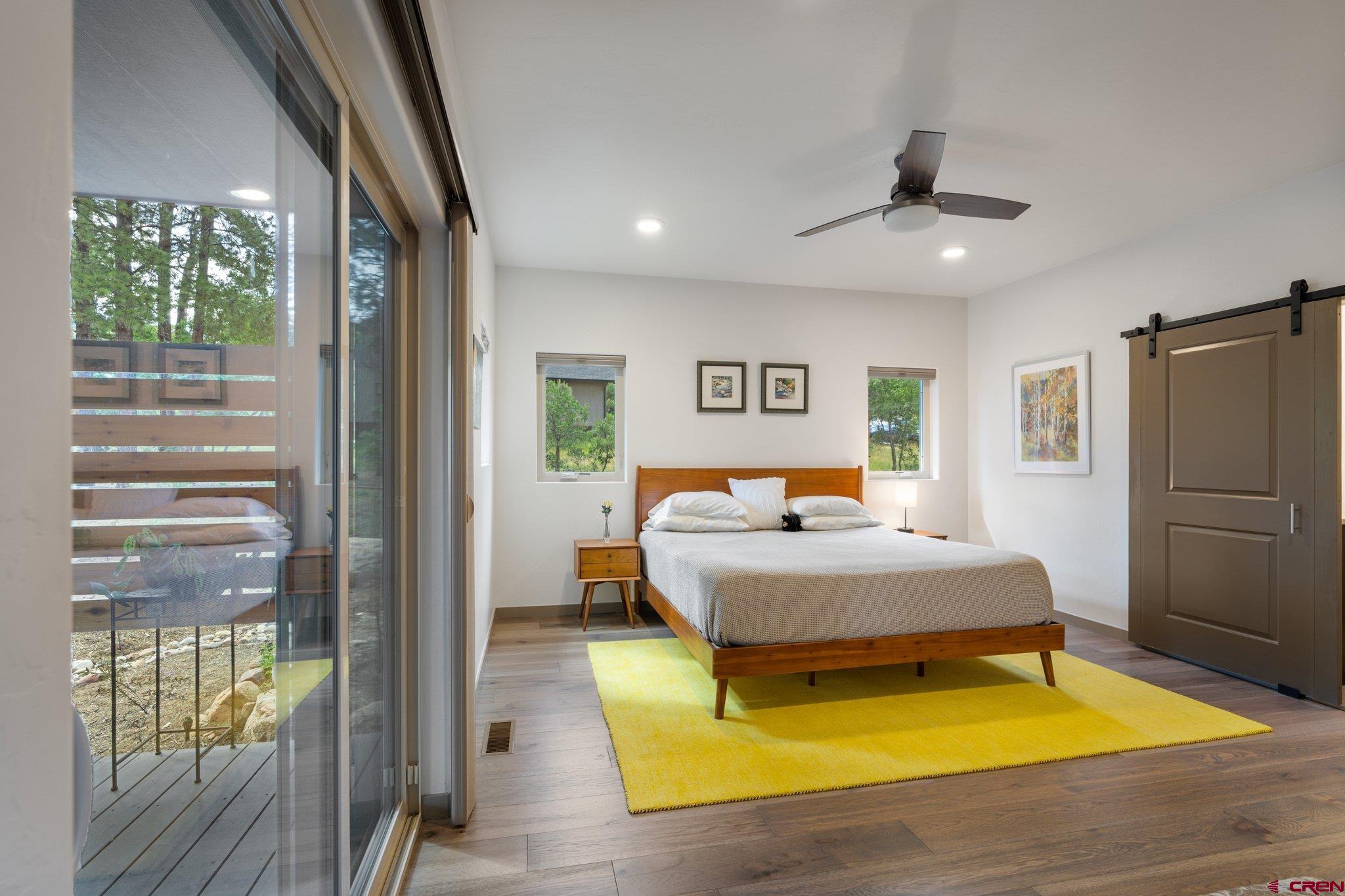 65 Needle Creek Trail Durango, CO 81301 - Photo 18 of 35 a bedroom with a bed and wooden floor
