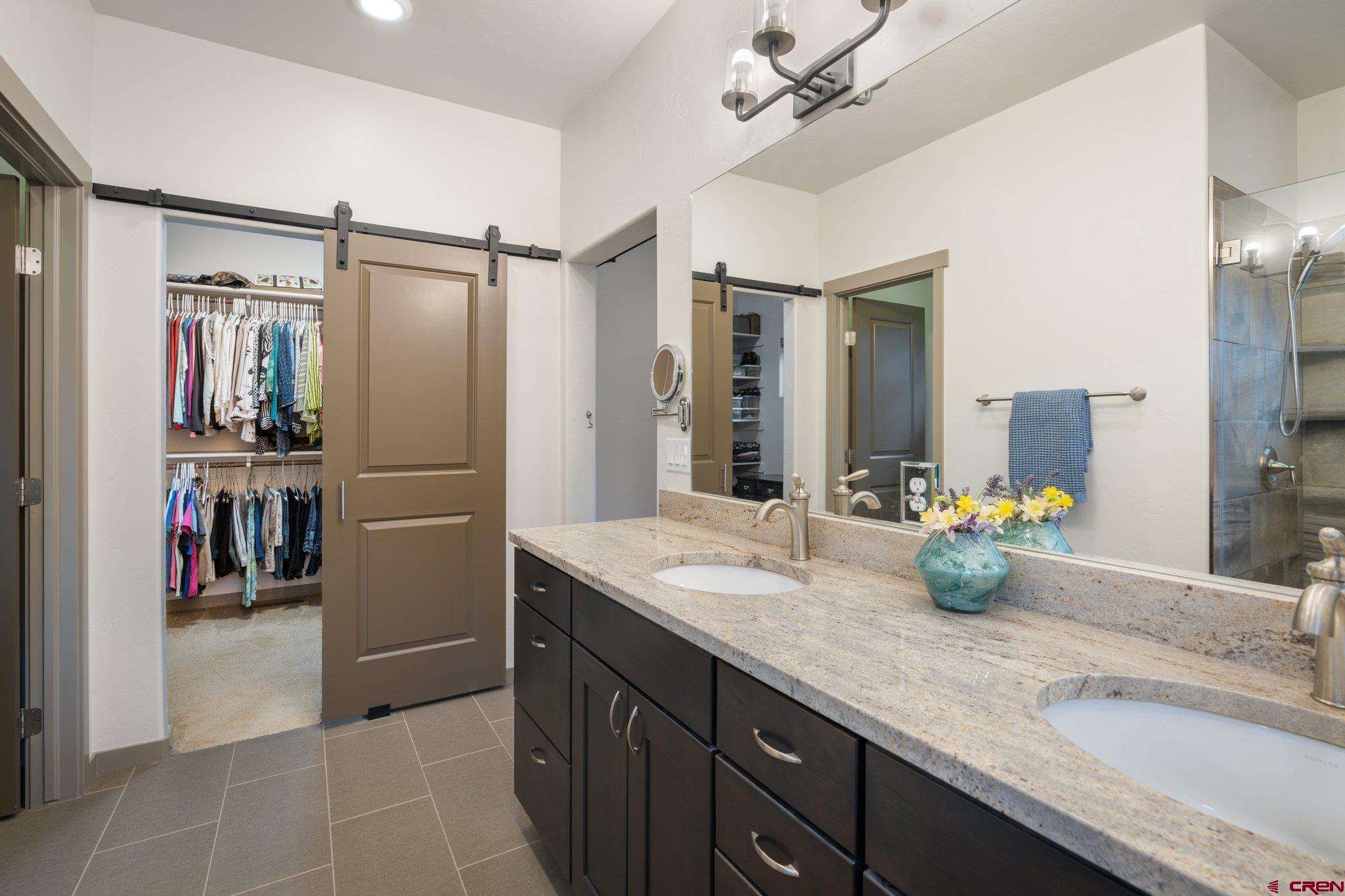 65 Needle Creek Trail Durango, CO 81301 - Photo 20 of 35 a bathroom with a sink double vanity and a shower