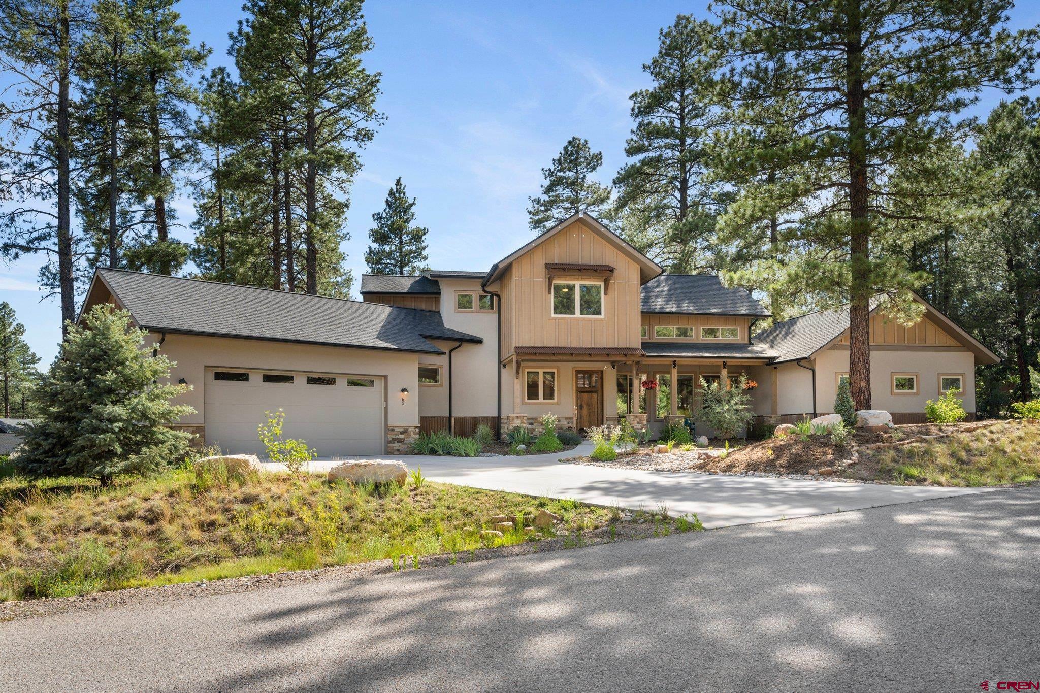 65 Needle Creek Trail Durango, CO 81301 - Photo 2 of 35 a front view of a house with a yard
