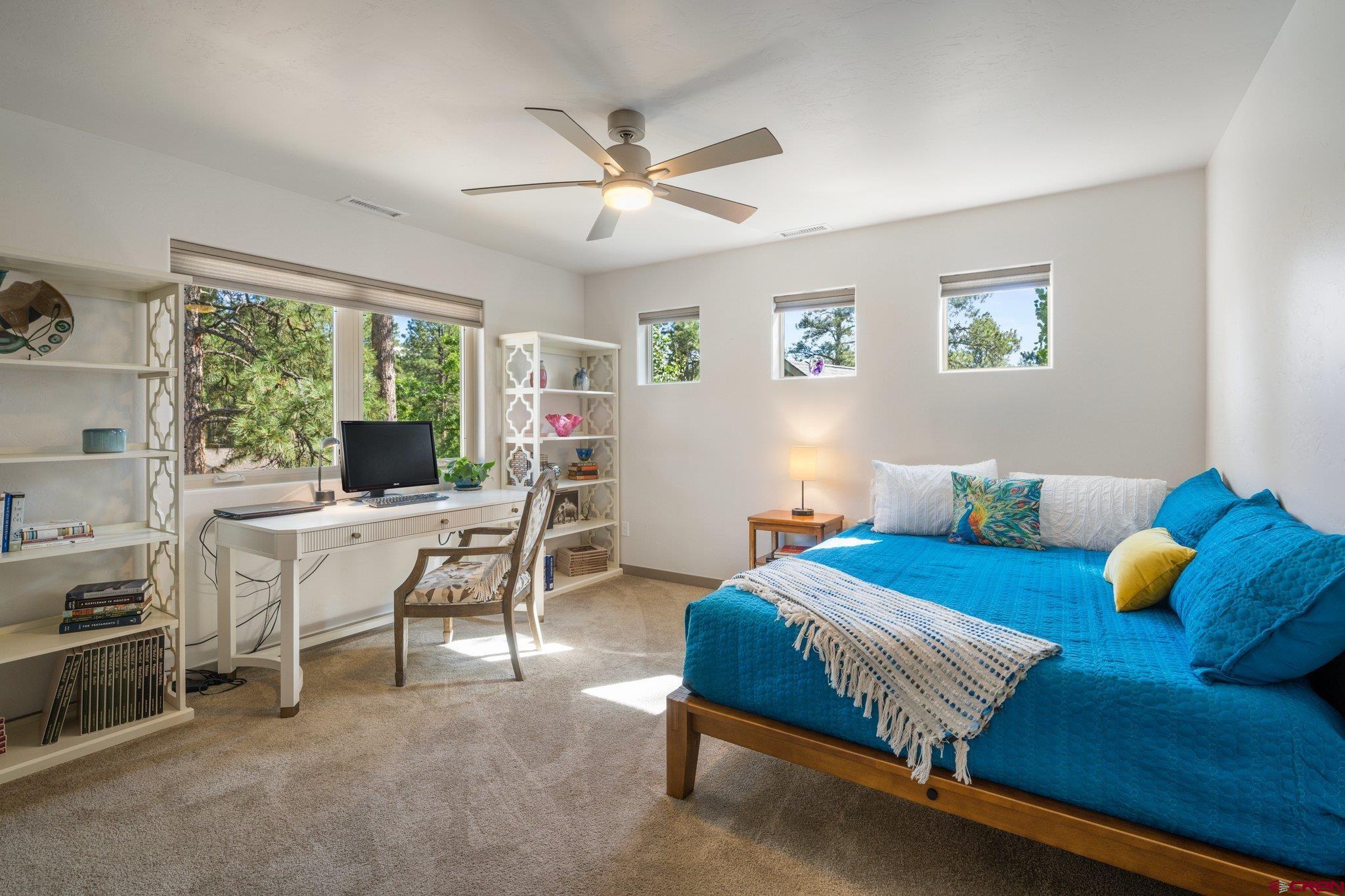 65 Needle Creek Trail Durango, CO 81301 - Photo 29 of 35 a bedroom with a bed and a table chair
