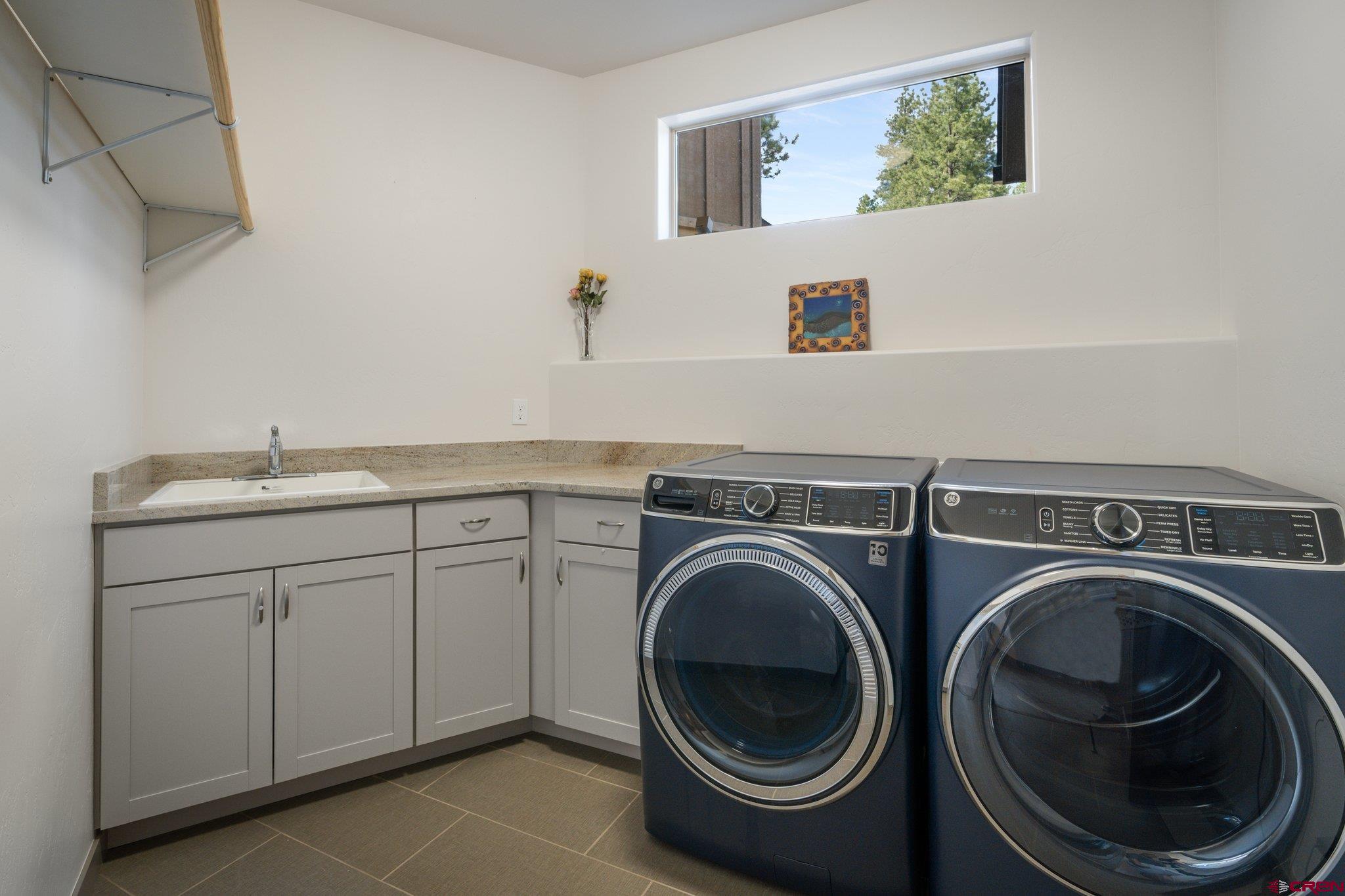 65 Needle Creek Trail Durango, CO 81301 - Photo 33 of 35 a utility room with sink dryer and washer