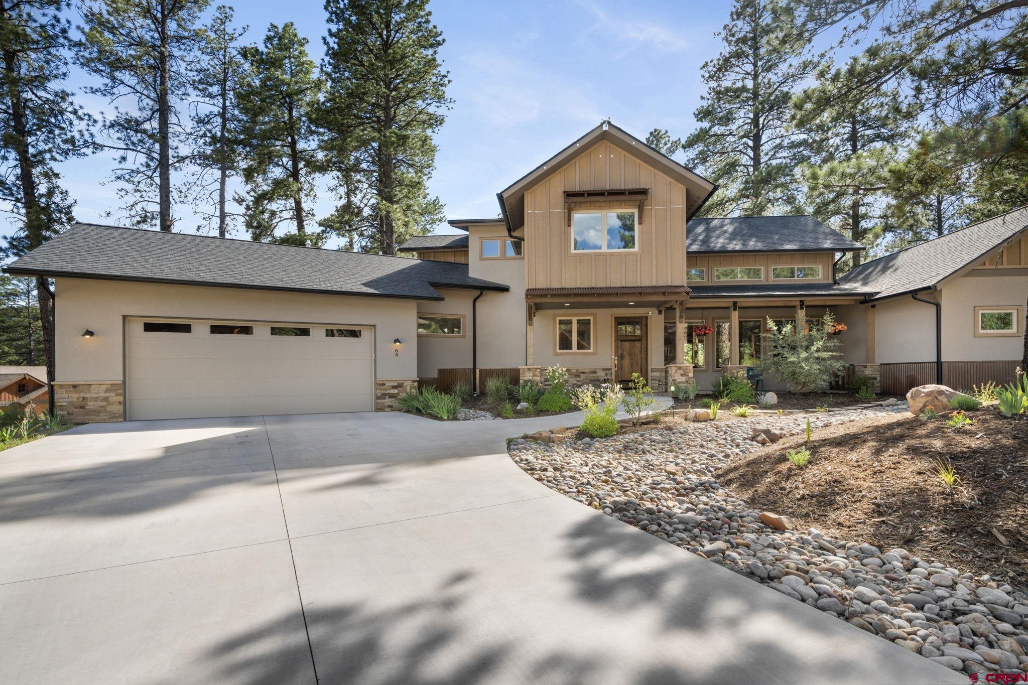 65 Needle Creek Trail Durango, CO 81301 - Photo 34 of 35 a front view of a house with a garden