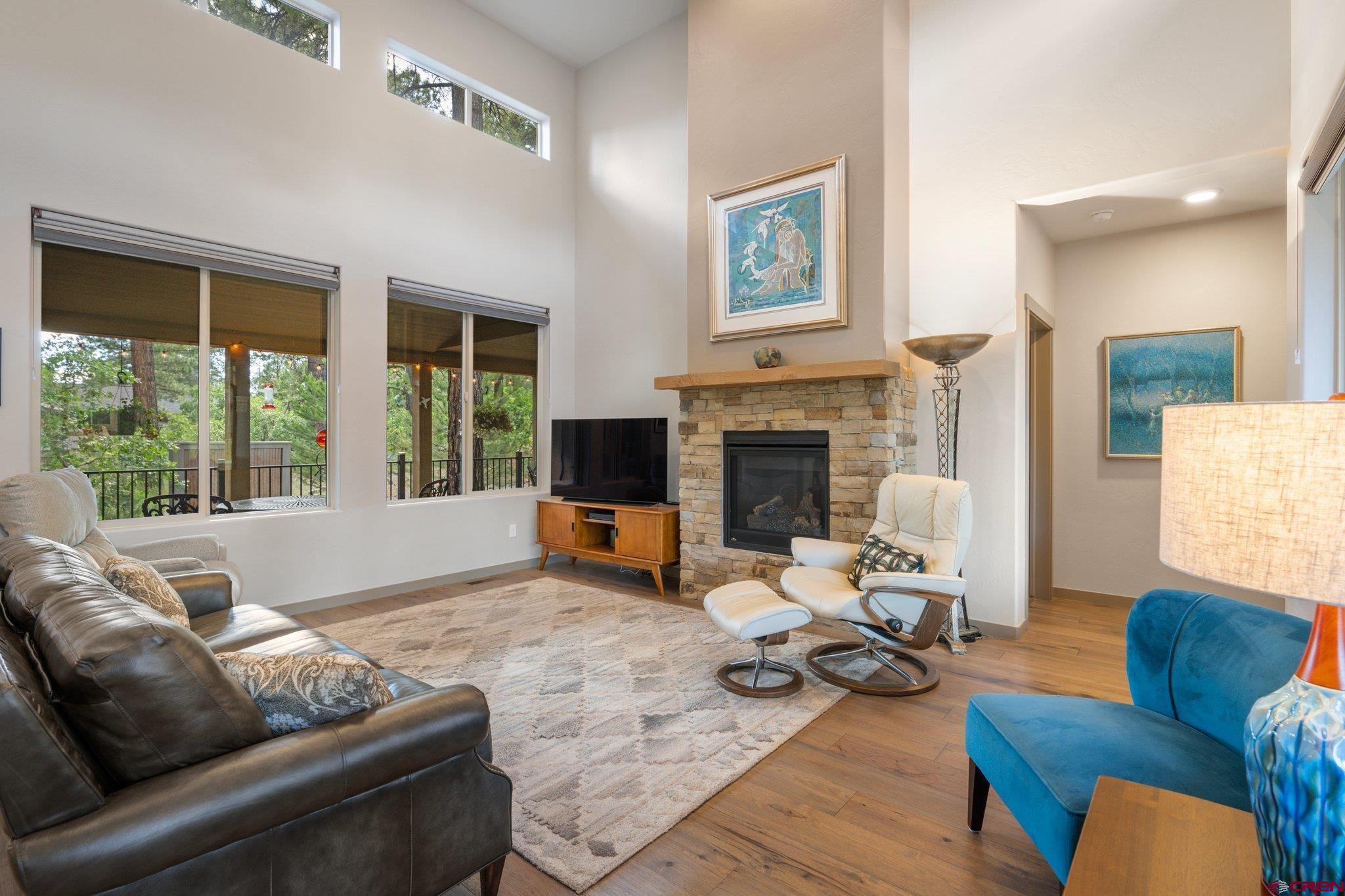 65 Needle Creek Trail Durango, CO 81301 - Photo 4 of 35 a living room with furniture fireplace and a large window