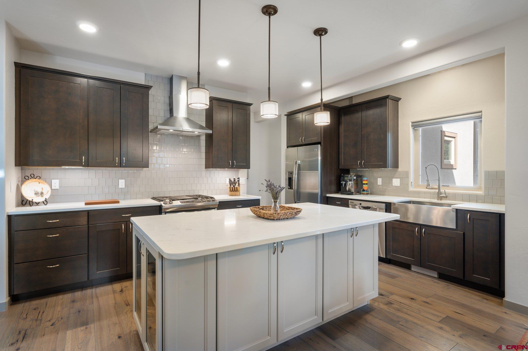 65 Needle Creek Trail Durango, CO 81301 - Photo 7 of 35 a kitchen with a sink stove and microwave