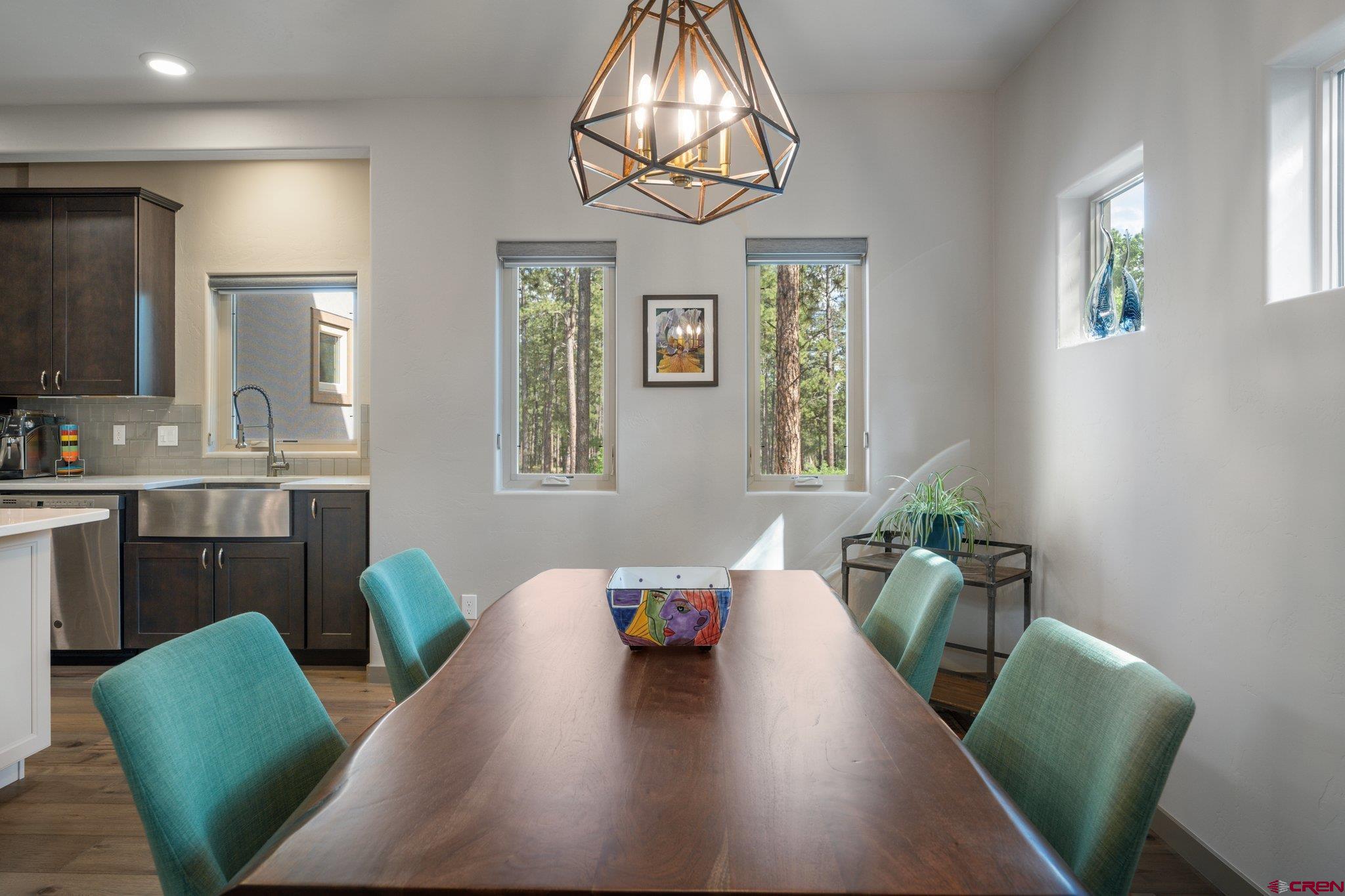65 Needle Creek Trail Durango, CO 81301 - Photo 9 of 35 a living room with furniture and a chandelier