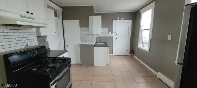 a kitchen with a stove and a refrigerator