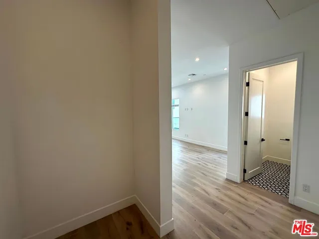 a bathroom with a sink toilet and a mirror