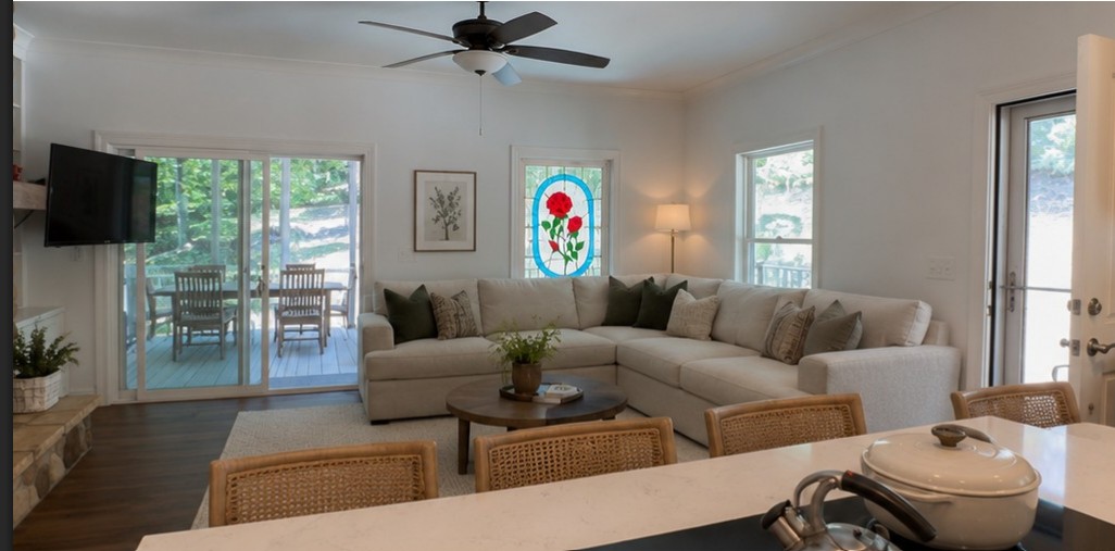 2 Lookout Lane Salem, SC 29676 - Photo 8 of 48 Bright, inviting living area seamlessly transitions to a spacious outdoor dining deck through sliding glass doors.