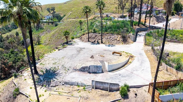 a view of a swimming pool with a yard