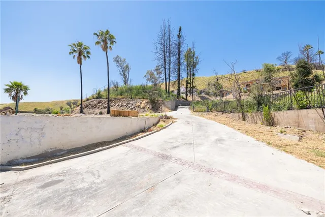 a view of a swimming pool with a house
