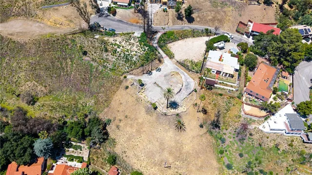 an aerial view of a city and mountain