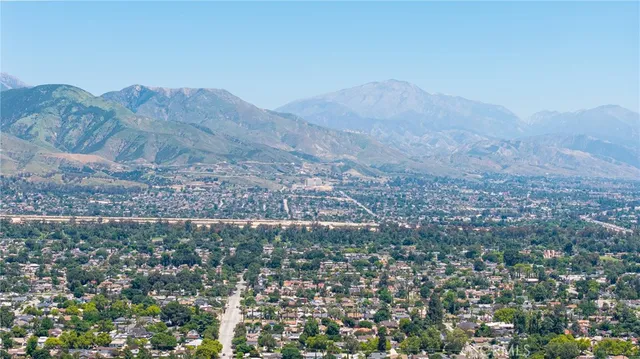 an aerial view of a house with a yard and garden