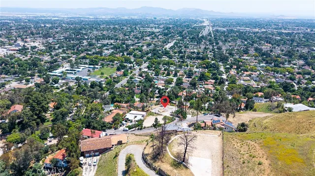 a view of multiple houses with a yard