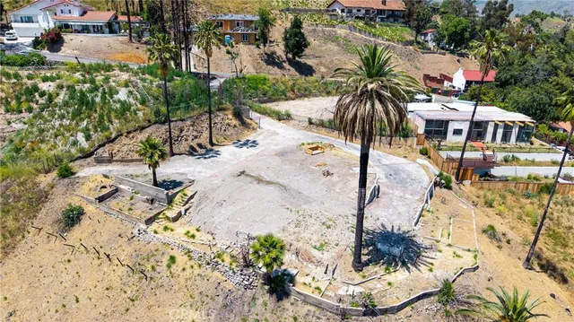 an aerial view of residential house with green space