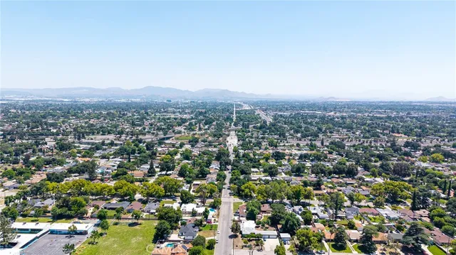 an aerial view of a house with a swimming pool