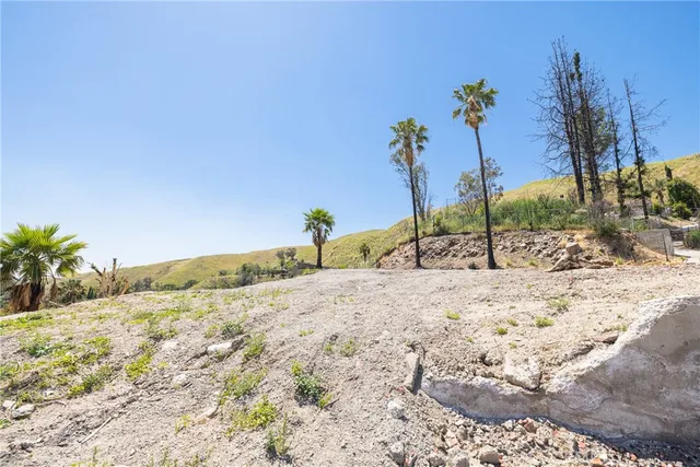 an aerial view of a house with a backyard