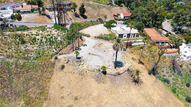 an aerial view of a houses with yard
