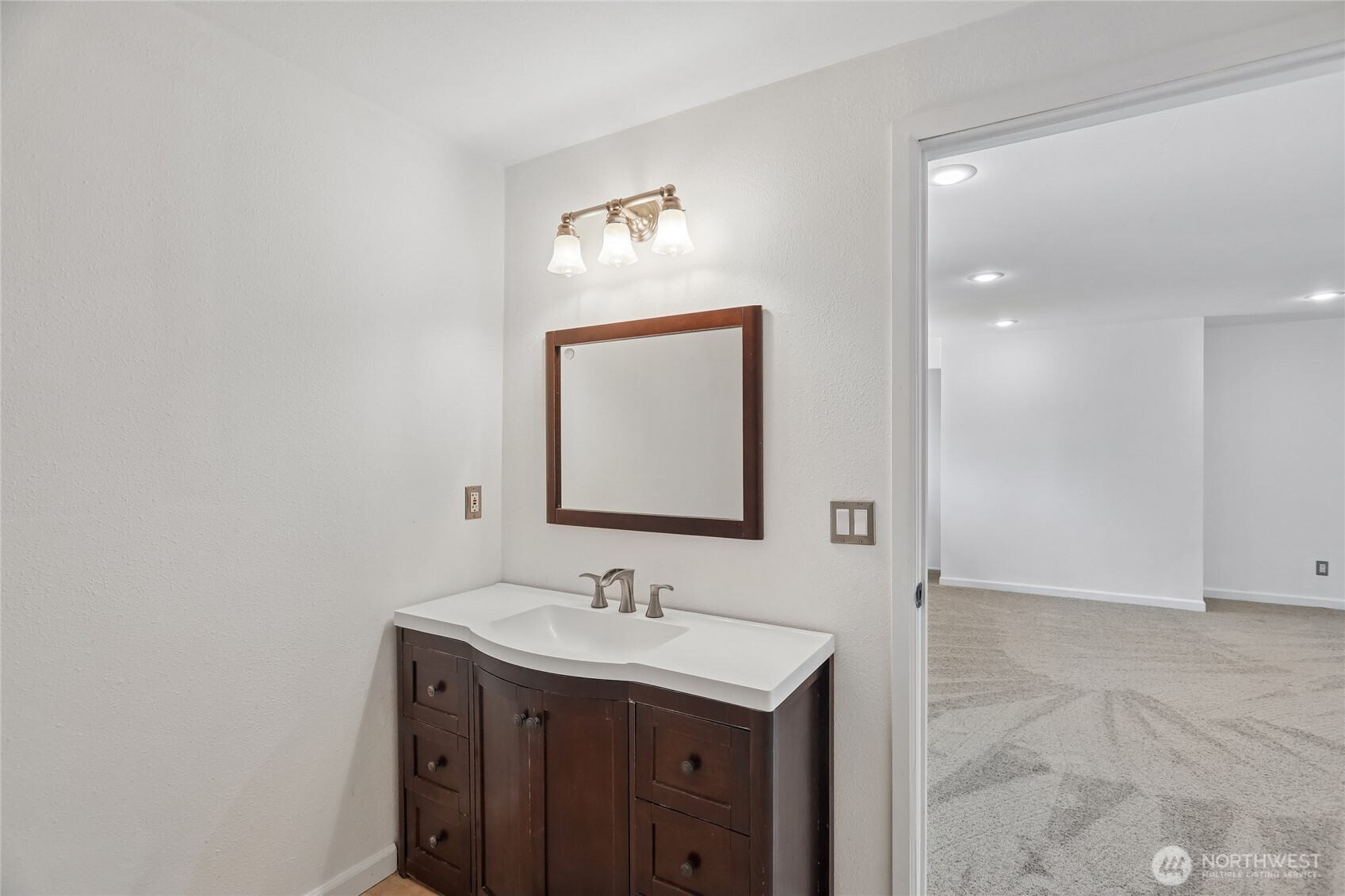 28601 Southeast 225th Street Maple Valley, WA 98038 - Photo 24 of 40 a bathroom with a sink and a mirror