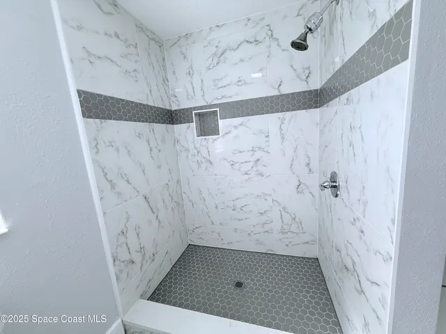 a bathroom with a toilet sink and shower