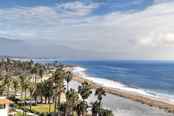 a kitchen with a stove and white cabinets