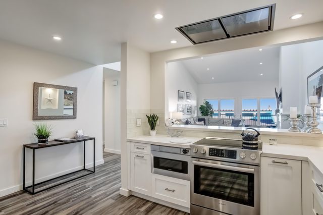 a bedroom with two beds and a large window