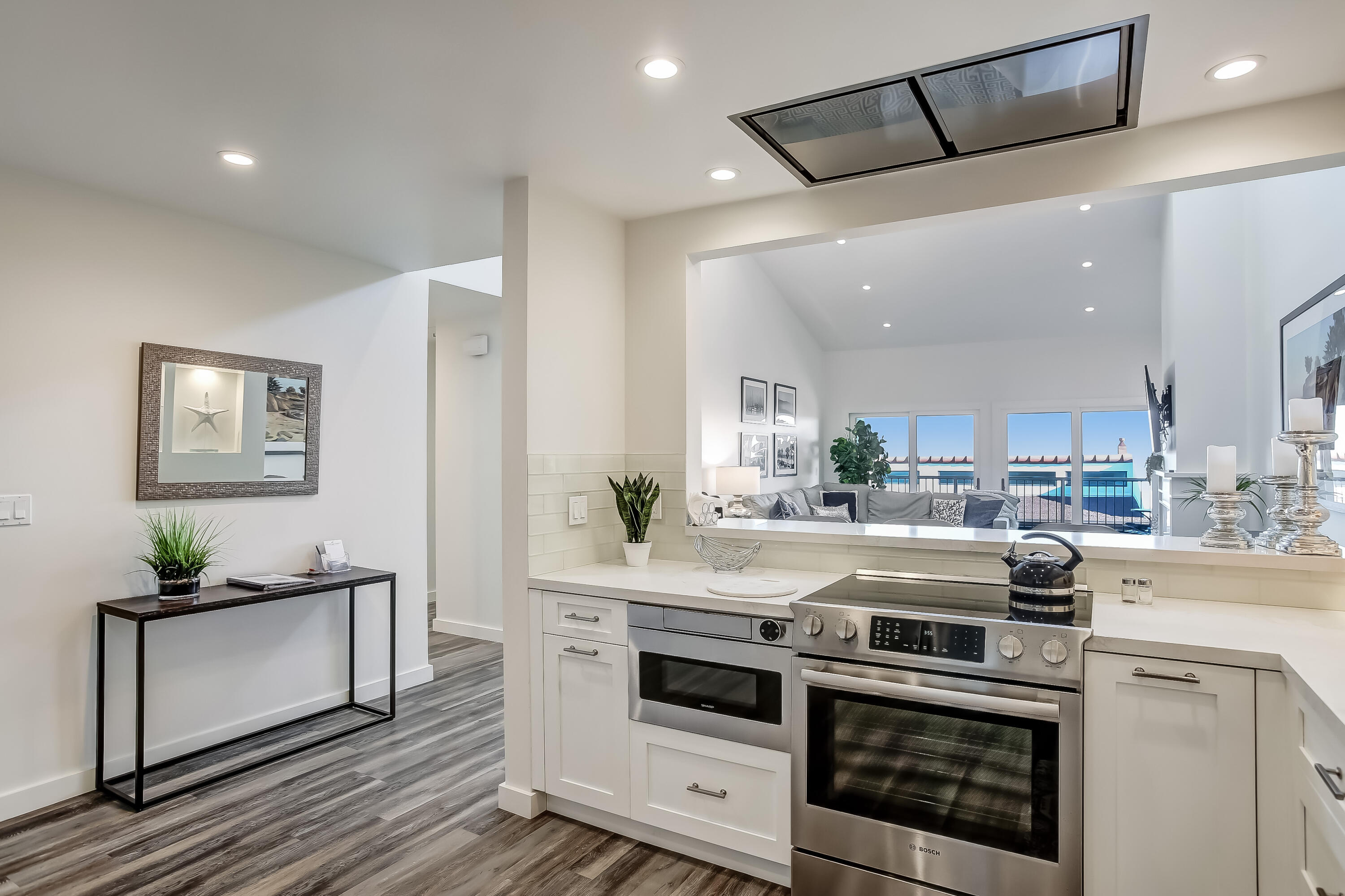 Undisclosed Address Santa Barbara, CA 93109 - Photo 12 of 16 a kitchen with a stove and white cabinets
